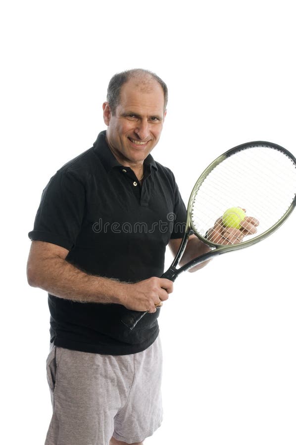 Happy senior middle age man demonstrating tennis stroke athletic staying healthy with exercise. Happy senior middle age man demonstrating tennis stroke athletic staying healthy with exercise