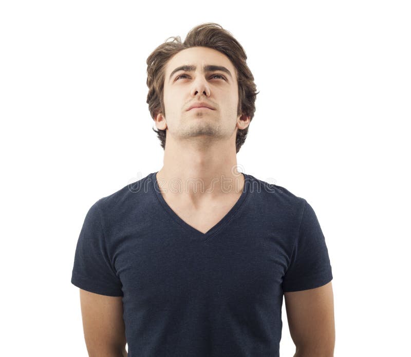 Hombre pensativo hermoso que mira para arriba en blanco foto de archivo