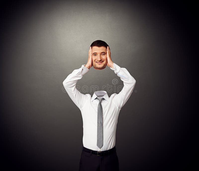 Hombre Sin Cabeza Que Lleva a Cabo La Cabeza Sonriente Foto de archivo