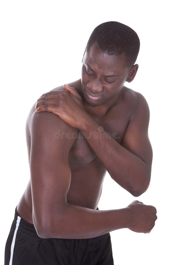 Hombre que sufre de dolor del hombro foto de archivo Hombre que sufre de dolor del hombro foto de archivo
