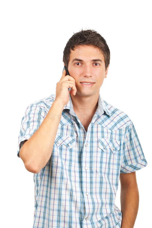 Young man having a funny conversation by phone mobile and making a face isolated on white background,check also. Young man having a funny conversation by phone mobile and making a face isolated on white background,check also