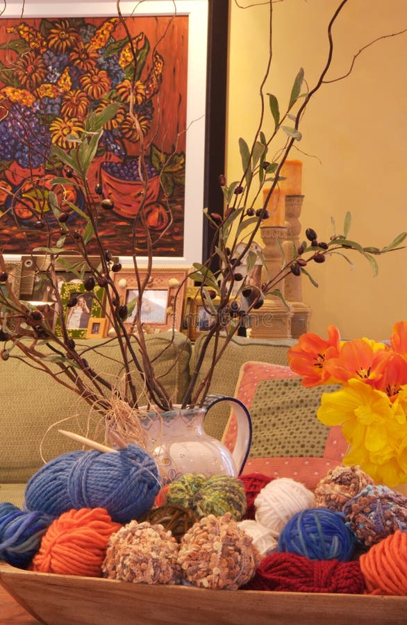 Artistic home display with artwork, vase and colorful,yarn. Artistic home display with artwork, vase and colorful,yarn