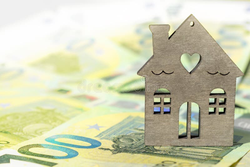 Home on a blurred money background. Euro banknotes and house close-up. Mortgage, savings, real estate. Copy space royalty free stock photos Home on a blurred money background. Euro banknotes and house close-up. Mortgage, savings, real estate. Copy space royalty free stock photos