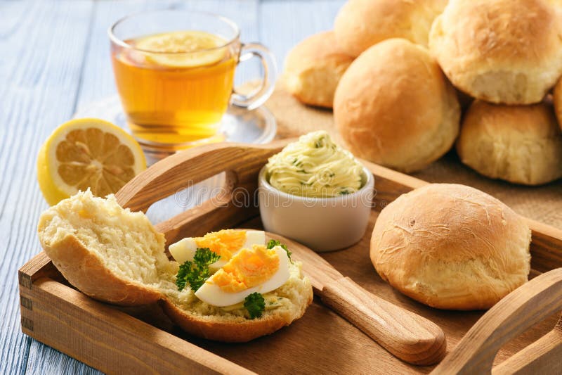 Home Breakfast Homemade Bread Rolls, Cup of Tea, Boiled Eggs and