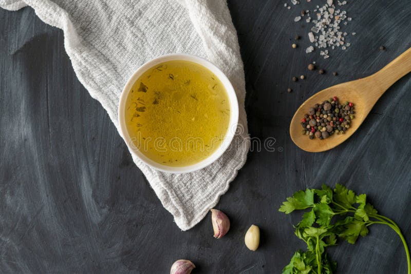 home cooked boullion or clear soup in a ceramic bowl at the kitchen, healthy food and diets