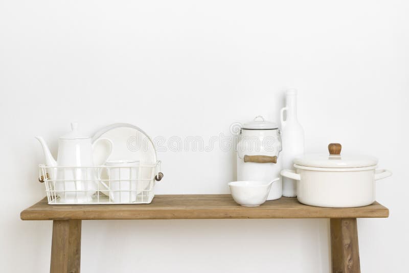 Home Decor Concept with Kitchen Utensils and Dishware on Table Stock