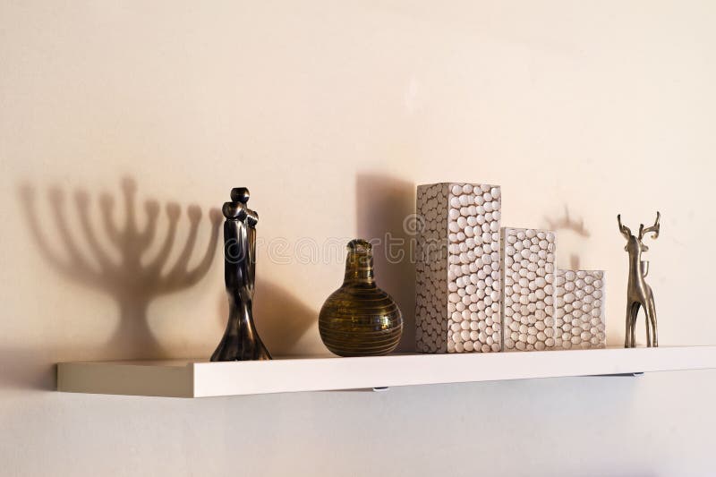 Wall shelf featuring home decorations