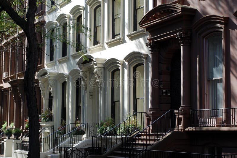 A row of brownstone homes in the old landmark neighborhood of Brooklyn Heights in New York City. A row of brownstone homes in the old landmark neighborhood of Brooklyn Heights in New York City.