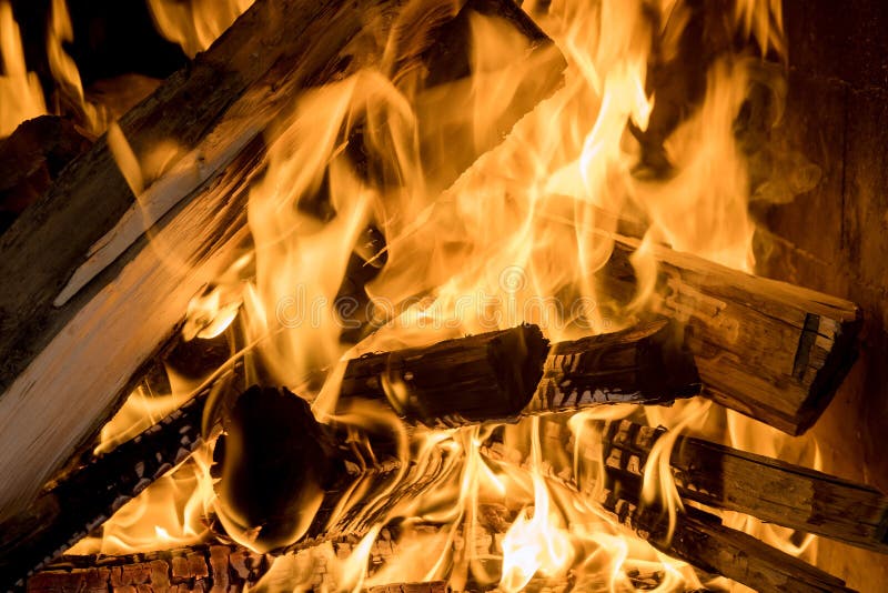 Home Fire Glowing Pieces in Fireplace with Burning Wood Stock Photo