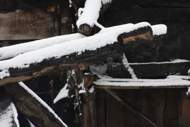 Home fire insurance. snow and a burnt stock photos Home fire insurance. snow and a burnt stock photos