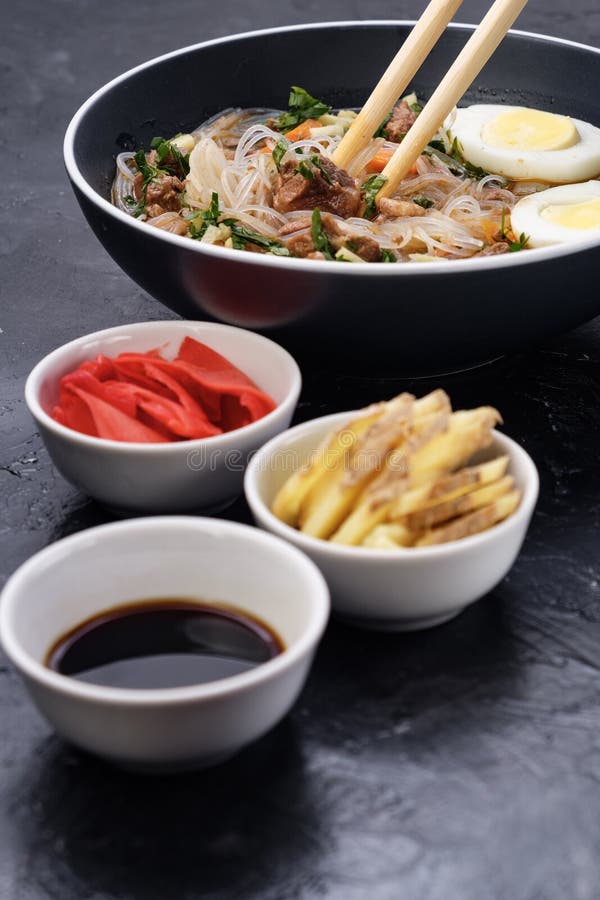 Home food Asia, Vietnam, egg noodle soup, colorful food ingredient for this food such as egg, beef, broth, ginger, soy sauce