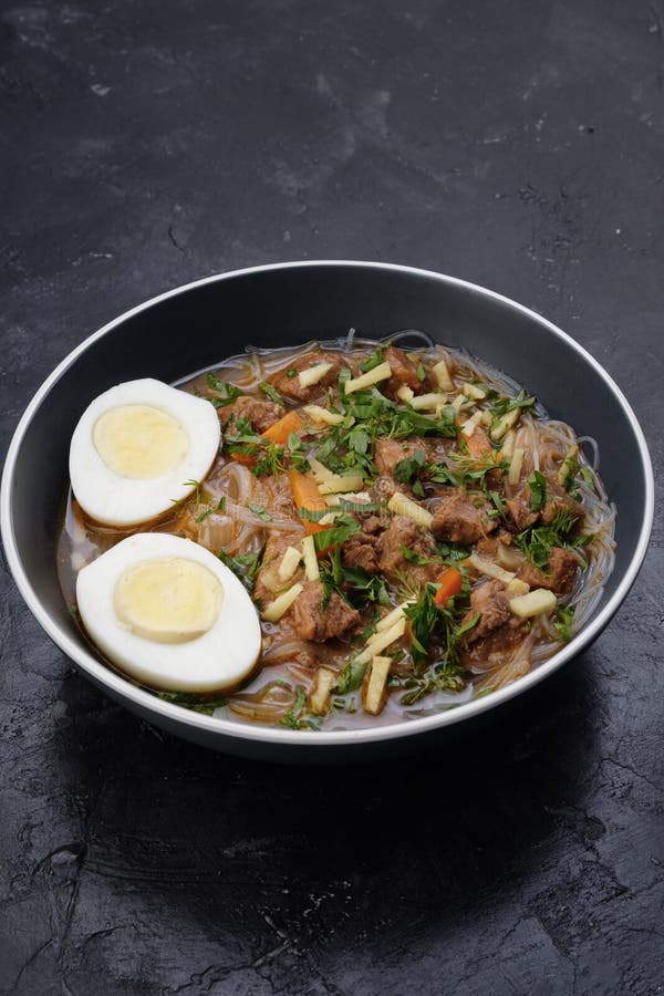 Home food Asia, Vietnam, egg noodle soup, colorful food ingredient for this food such as egg, beef, broth, ginger, soy sauce