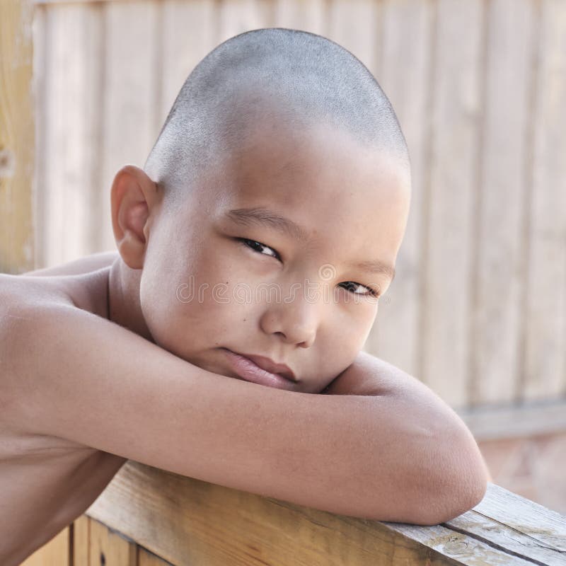 Portrait of Tanned Asian Boy, Hair Cut Bald, Looking at Camera Stock Photo  - Image of serious, halflength: 223071836
