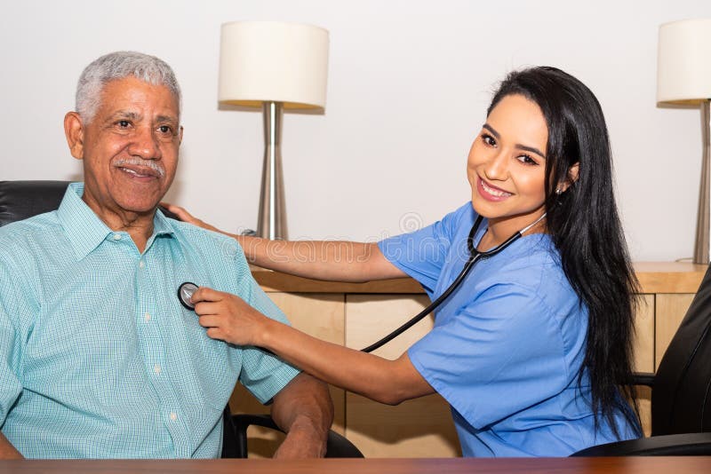 Home Health Care Nurse Assisting Elderly Patient