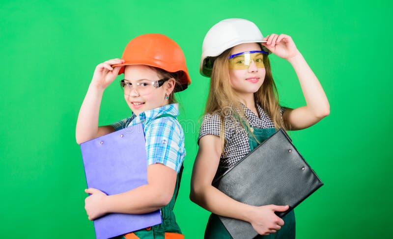Home improvement activities. Builder engineer architect. Future profession. Kids girls planning renovation. Initiative stock photo Home improvement activities. Builder engineer architect. Future profession. Kids girls planning renovation. Initiative stock photo