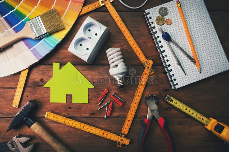 Home improvement and repair concept - work tools and objects on wooden table