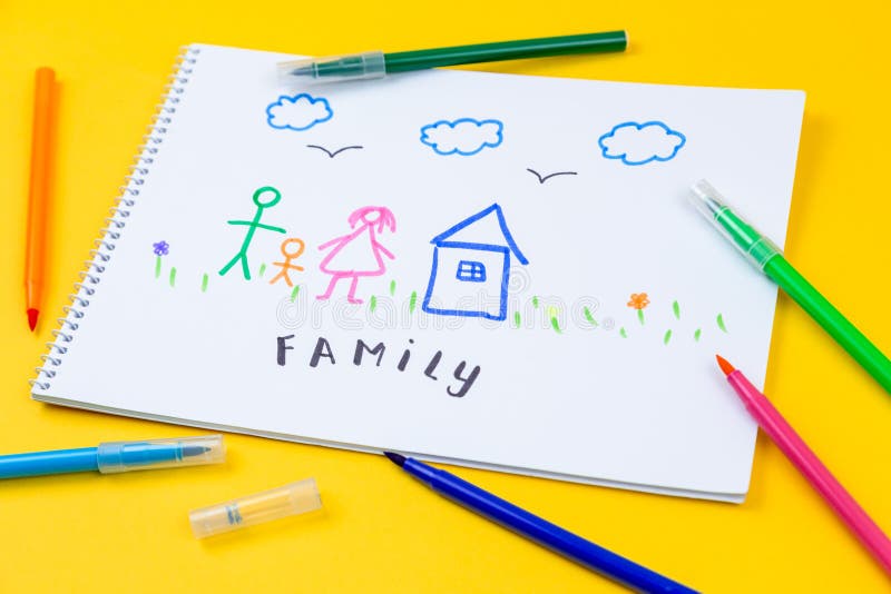 Home, love, family, still life concept. felt-tip pen lying on a paper with children`s drawing family. Selective focus, copy space background.
