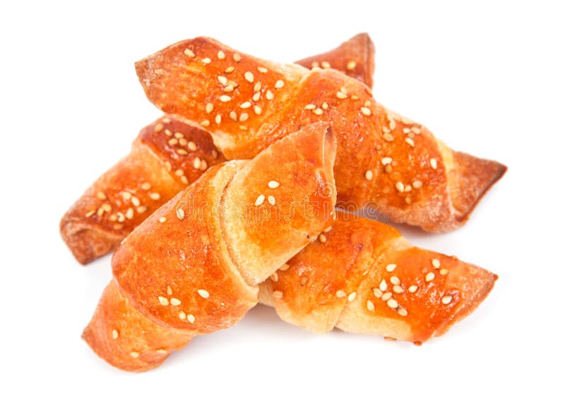 Home made bread rolls with sesame seeds on white