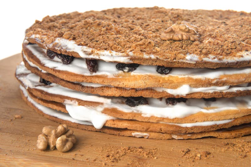 Home made cake decorated with nuts, raisins and white cream stock photography Home made cake decorated with nuts, raisins and white cream stock photography