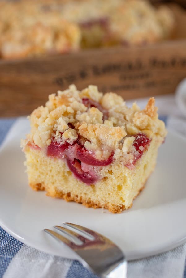 Home made cherry streusel cake with vanilla pudding on a table