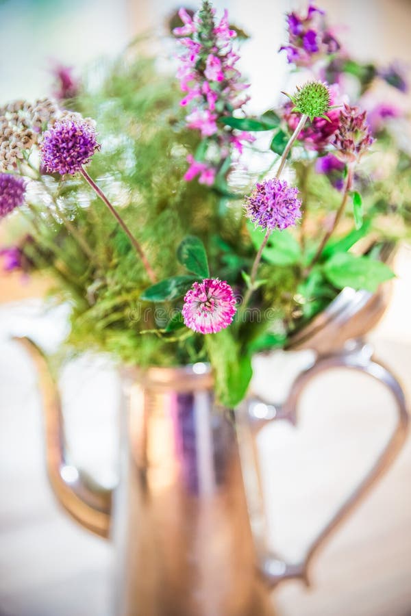 Home made Fresh Wild Flowers Bouquet in Silver Pot on Wood Table royalty free stock images Home made Fresh Wild Flowers Bouquet in Silver Pot on Wood Table royalty free stock images