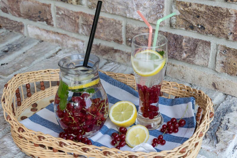 Home-made refreshing lemonade of red currant with ice and lemon royalty free stock image Home-made refreshing lemonade of red currant with ice and lemon royalty free stock image