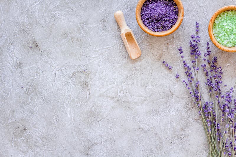 Home spa with lavender herbs cosmetic salt for bath on stone desk background top view mock-up royalty free stock images Home spa with lavender herbs cosmetic salt for bath on stone desk background top view mock-up royalty free stock images