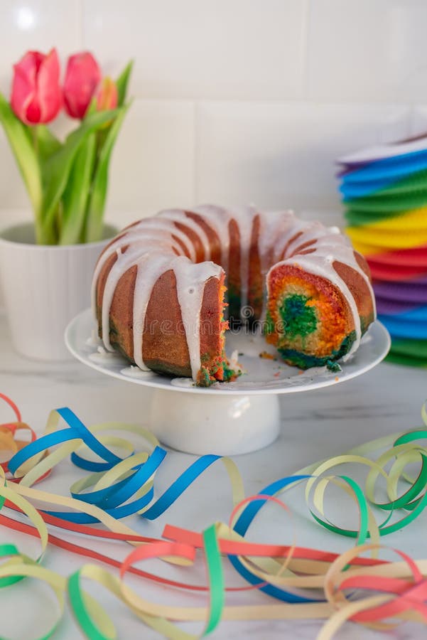 Home made sweet rainbow sponge cake stock photos