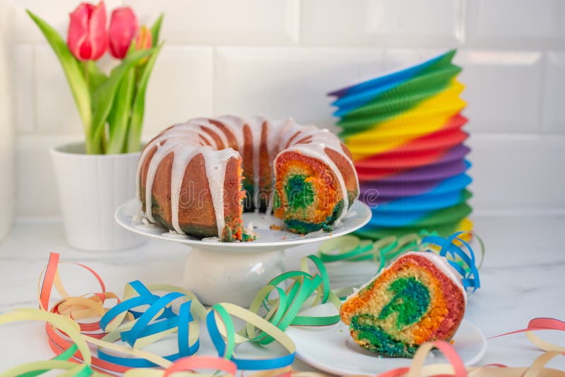 Home made sweet rainbow sponge cake stock image