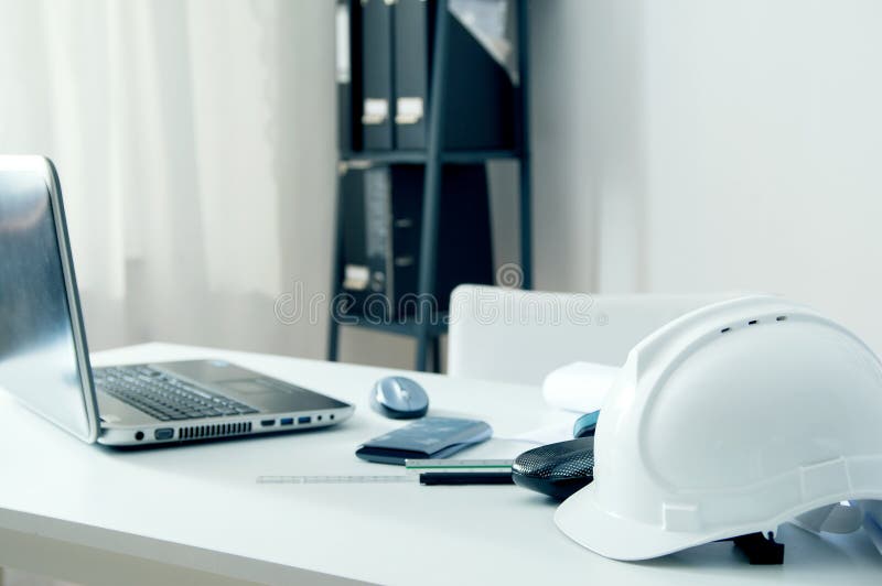 Home office of an architect with white helmet