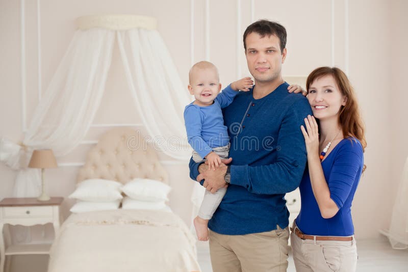 Home portrait of happy young family. royalty free stock images Home portrait of happy young family. royalty free stock images