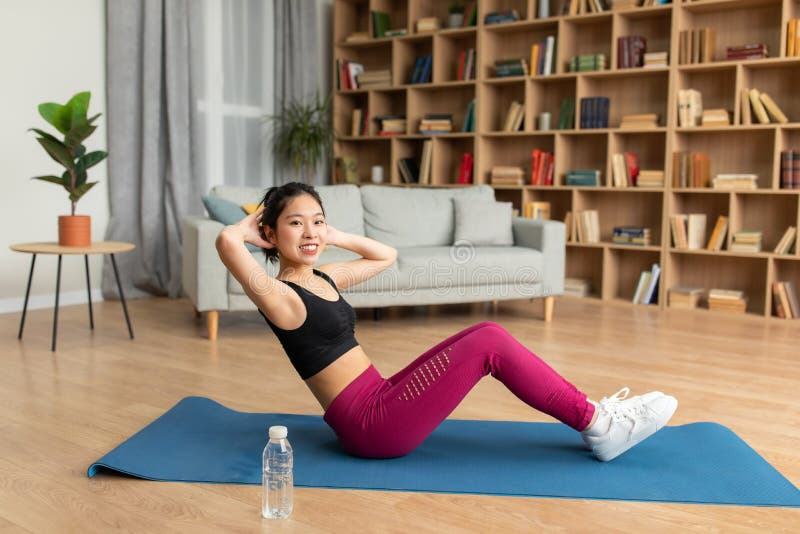 Home Training Concept. Fit Asian Lady Exercising and Doing Sit-ups Abs ...