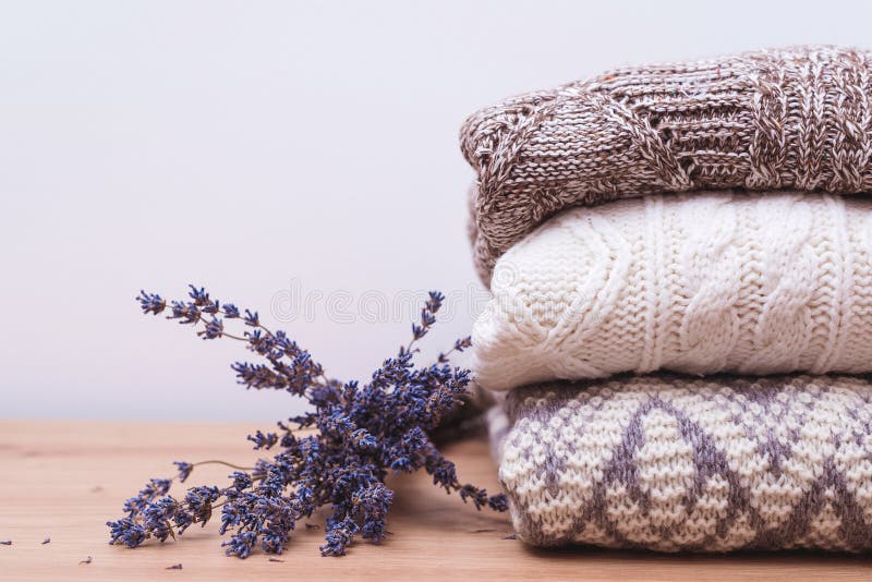 https://thumbs.dreamstime.com/b/home-wardrobe-winter-clothes-woolen-sweaters-dried-lavender-protection-moth-knitted-warm-wool-stack-autumn-230732522.jpg