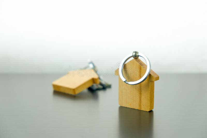 Home wooden key chains on table