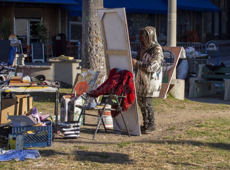 One of several artist in Venice painting a picture in Venice Beach, California.  Venice Beach is considered a cultural link for the rest of LA. Throughout the years, it has been known to be a hub of artistic inspiration and creativity.  It is also a place of rampant homelessness. One of several artist in Venice painting a picture in Venice Beach, California.  Venice Beach is considered a cultural link for the rest of LA. Throughout the years, it has been known to be a hub of artistic inspiration and creativity.  It is also a place of rampant homelessness.