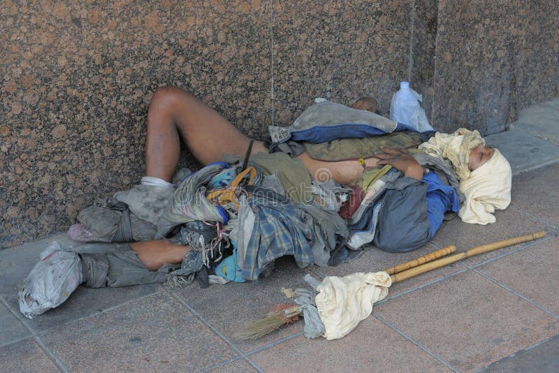 Homeless Man Sleeps on the Street. 
