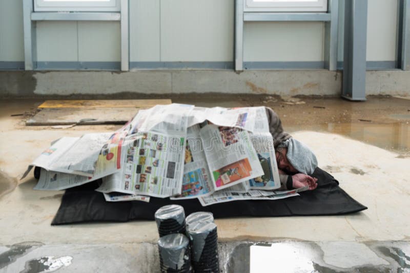 https://thumbs.dreamstime.com/b/homeless-men-sleeping-construction-site-man-wet-floor-covered-newspapers-90902350.jpg