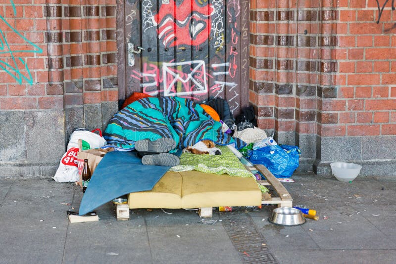 homeless-oberbaum-bridge-berlin-germany-berlin-germany-april-homeless-man-asleep-over-blanketon-dog-148768758.jpg