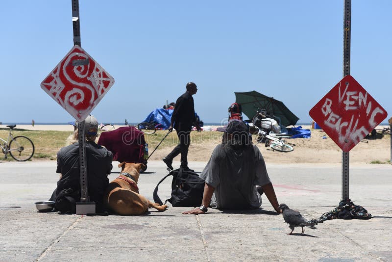 VENICE BEACH, USA - MAY 18, 2017: Homeless people on world famous Venice Beach Boardwalk one of the most popular attraction of California, on May 18, 2017 Venice Beach, CA. VENICE BEACH, USA - MAY 18, 2017: Homeless people on world famous Venice Beach Boardwalk one of the most popular attraction of California, on May 18, 2017 Venice Beach, CA