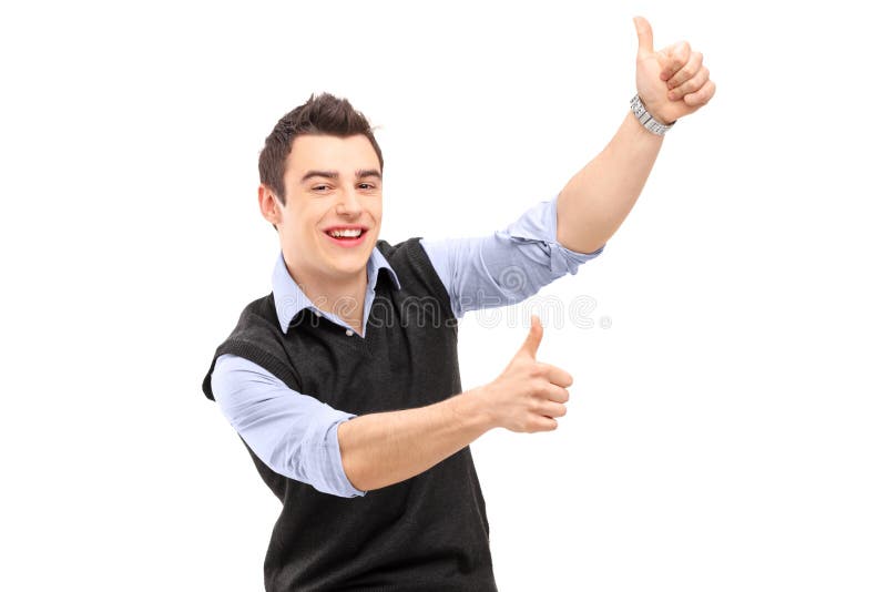 Homem alegre novo que gesticula a felicidade com polegares acima fotos de stock royalty free Homem alegre novo que gesticula a felicidade com polegares acima fotos de stock royalty free