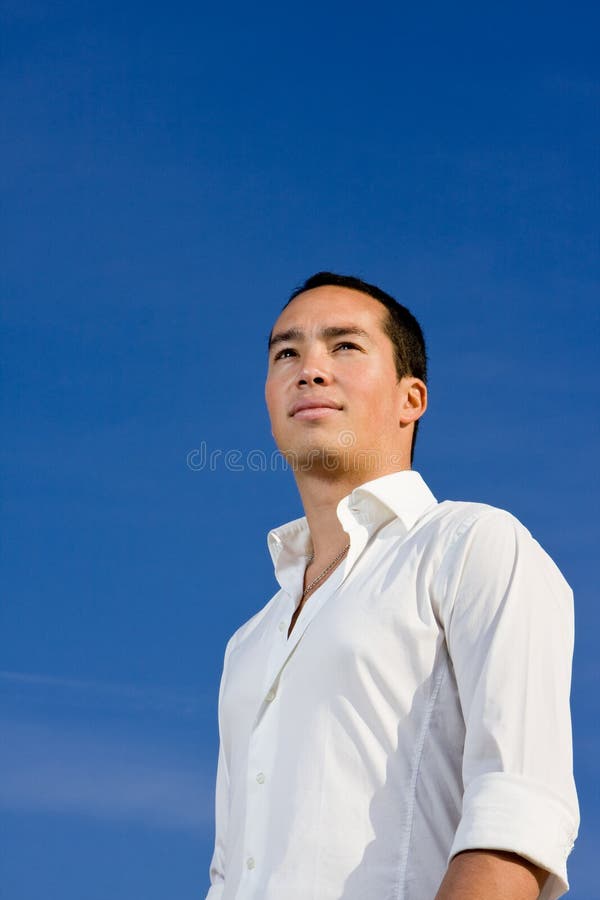 Smart handsome asian man looking forward in a positive and brave manner. Smart handsome asian man looking forward in a positive and brave manner