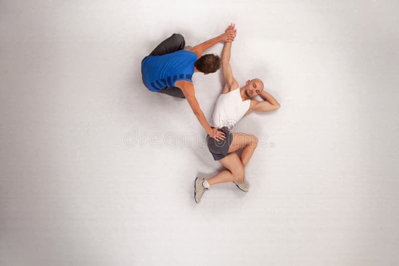 Overhead view of streching with personal trainer. Overhead view of streching with personal trainer