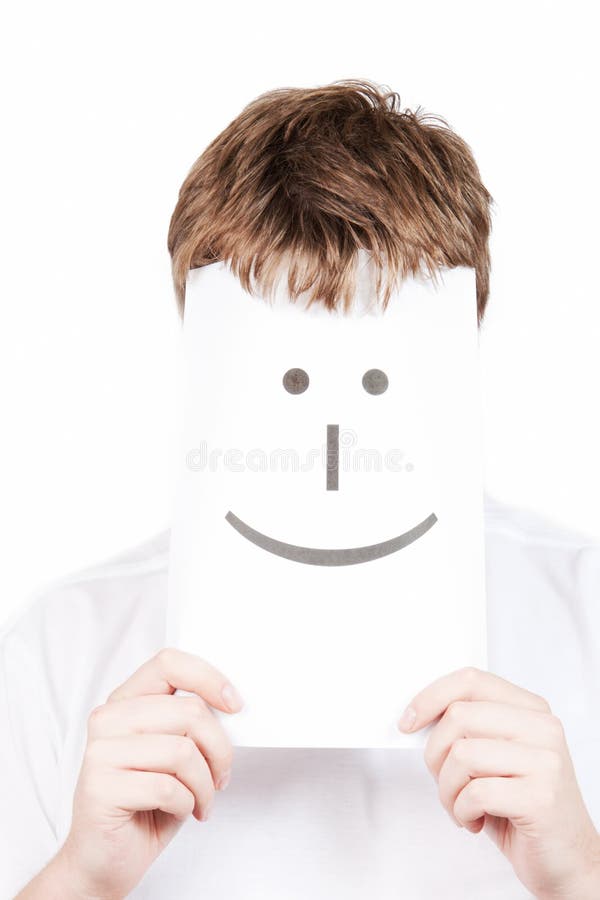 Funny young man with with a smile face drawn on paper isolated on a white background. Funny young man with with a smile face drawn on paper isolated on a white background