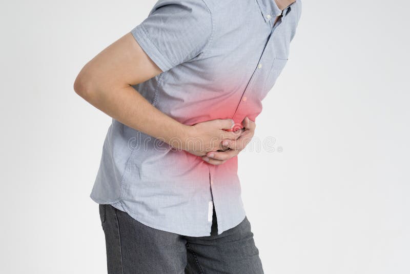 Man with abdominal pain, stomach ache on gray background, with red dot. Man with abdominal pain, stomach ache on gray background, with red dot