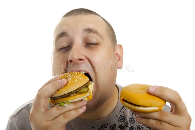 Homem com fome com Hamburger. fotos de stock royalty free Homem com fome com Hamburger. fotos de stock royalty free