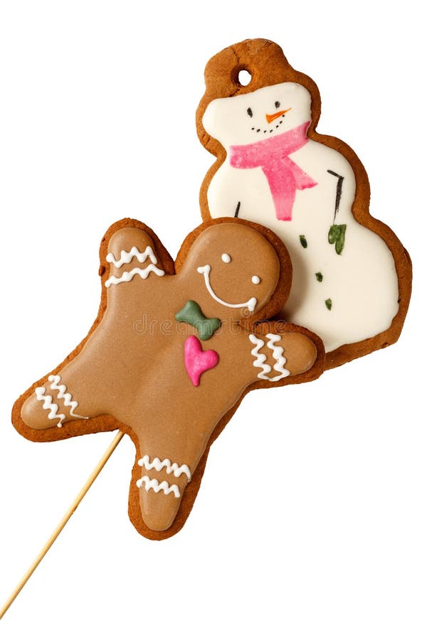 Homem congelado tradicional das cookies do Natal do pão-de-espécie com os bonecos de neve isolados fotos de stock Homem congelado tradicional das cookies do Natal do pão-de-espécie com os bonecos de neve isolados fotos de stock
