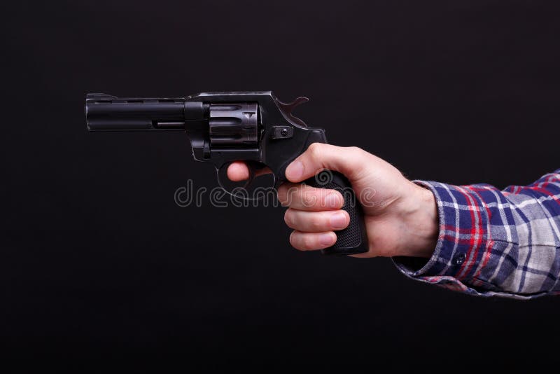 Homem considerável com o revólver imagens de stock Homem considerável com o revólver imagens de stock