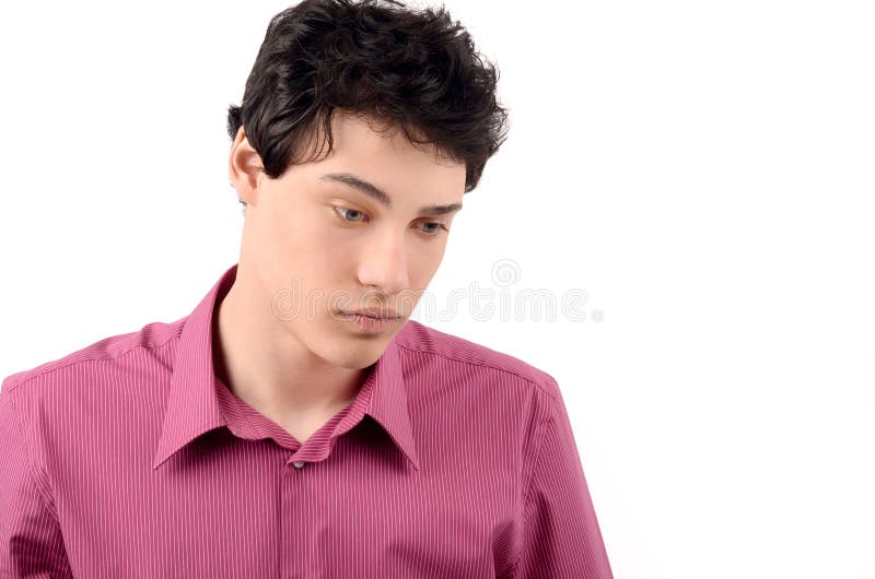 Homem de negócio novo triste que olha para baixo. imagens de stock royalty free Homem de negócio novo triste que olha para baixo. imagens de stock royalty free
