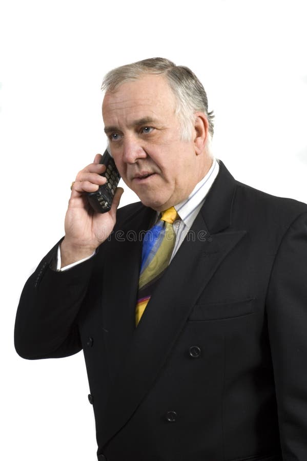Homem de negócios mais velho no telefone fotografia de stock Homem de negócios mais velho no telefone fotografia de stock