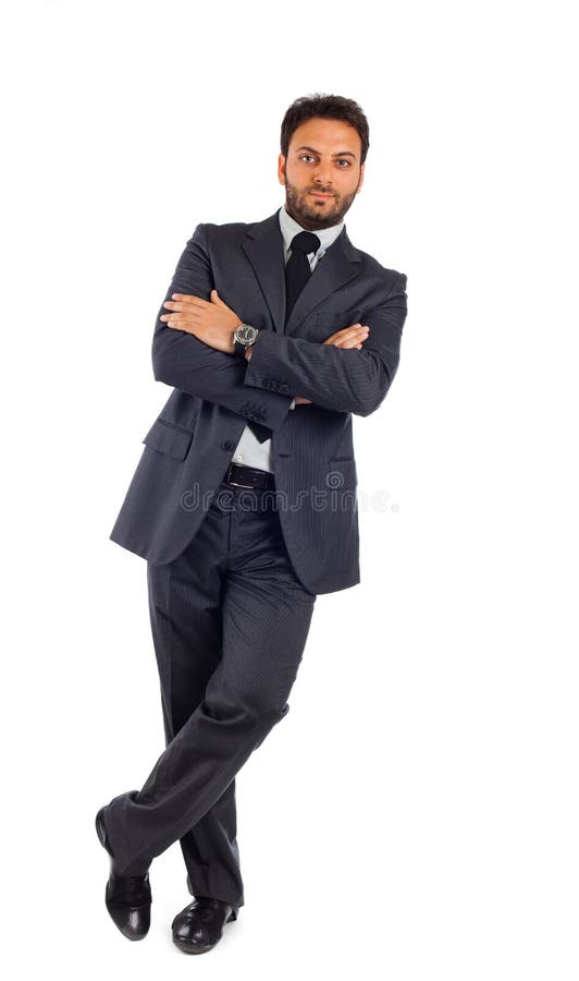 Homem de negócios novo com os braços cruzados foto de stock Homem de negócios novo com os braços cruzados foto de stock
